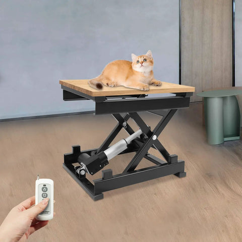 Rock Solid Electric Scissor Lift Table 130 Pound Capacity Adjustable Hydraulic Lifting Platform With Wireless Remote for shop use with cat on surface.