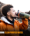 Man drinking from GeoPress 24 Oz Water Purifier Bottle For Hiking Camping Survival And Travel With Easy Fill Press To Drink Filter