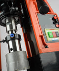 Close-up of Heavy Duty Mag Drill Press For Metal Core Drilling, featuring magnetic base and drill bit setup.