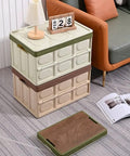 Heavy Duty Collapsible Storage Bins With Lid, Tough Camping Organizer Box For Car Trunk And Groceries, Converts To A Rock Solid Sitting Stool, 50 Liter Green Bin stacked with lid on a modern living room floor.
