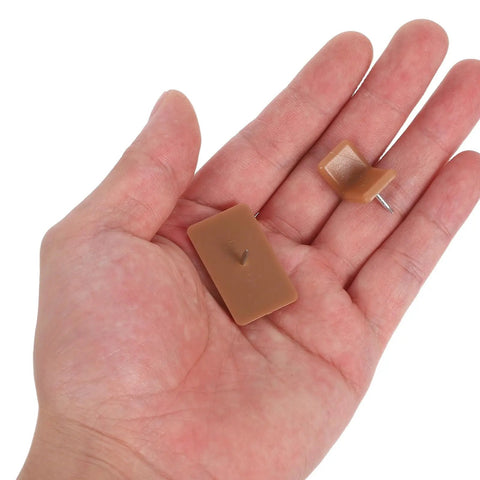 Hand holding 20 Piece Plastic And Iron Drawer Stopper Set For Dressers And Cabinets Quiet Noise Reducing Square And L Shape Glides