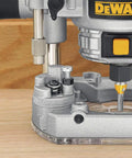 Close-up of Powerful 1.25 HP Variable Speed Router Kit With Fixed And Plunge Bases showing depth control on hardwood.
