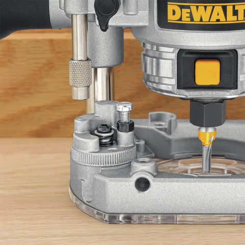 Close-up of Powerful 1.25 HP Variable Speed Router Kit With Fixed And Plunge Bases showing depth control on hardwood.