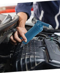 Mechanic using Mini Grease Gun 80cc With Locking Nozzle Manual Lubrication Tool For Excavators Cars And Industrial Equipment on engine