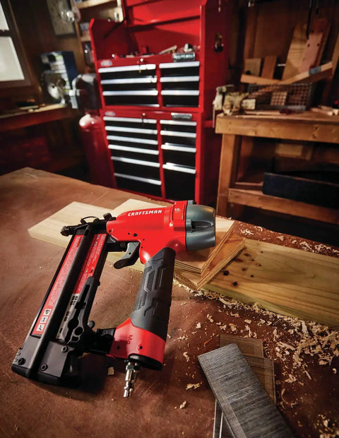 18 Gauge Brad Nailer Pneumatic Nail Gun With Oil-Free Motor, Pro Grade Performance, on workbench with wood and tools