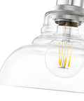 Close-up of Three Light Bath Vanity Fixture in Black with Dope Industrial Vibe showing clear glass shade and lightbulb detail.