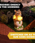 Charmed Solar Powered Led Outdoor Decor Porcelain Squirrel Figurine Light Up Garden Statue in a yard at night