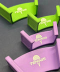 Green and purple wall brackets labeled 'Tennis' for racket wall mount organizer for tennis badminton ping pong multipurpose space saving rack bracket with easy setup heavy duty construction no tools needed safe edge design keeps gear neat accessible and ready
