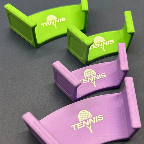Green and purple wall brackets labeled 'Tennis' for racket wall mount organizer for tennis badminton ping pong multipurpose space saving rack bracket with easy setup heavy duty construction no tools needed safe edge design keeps gear neat accessible and ready