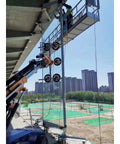 Men using Hassle Free Heavy Duty Glass Vacuum Lifter Remote Control Architectural Window Handler to install large glass panels.