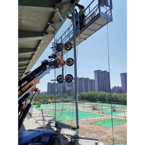 Men using Hassle Free Heavy Duty Glass Vacuum Lifter Remote Control Architectural Window Handler to install large glass panels.