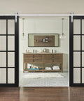 Heavy Duty Sliding Double Barn Door Kit With Clear Glass Steel Panels And Quiet Roller Silver Rail No Sweat Interior Hardware Package showcasing two black sliding doors.