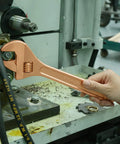 Hand using a beryllium copper 300mm pipe wrench from 36 Piece Non Sparking Tool Set For Pro Grade Jobs, non-magnetic and corrosion-resistant