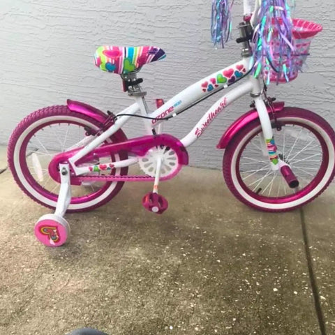 White toddler bike with pink solid toddler bicycle chain cover snap on no tools required protects clothing from chain lube for single speed and fixed gear bikes only easy installation.