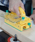 Heavy Duty Chip Deflector Connector Link For Grrripper Pushblocks Table Saw Safety Deck Handles Bridge Kit Router Table in use on wood.