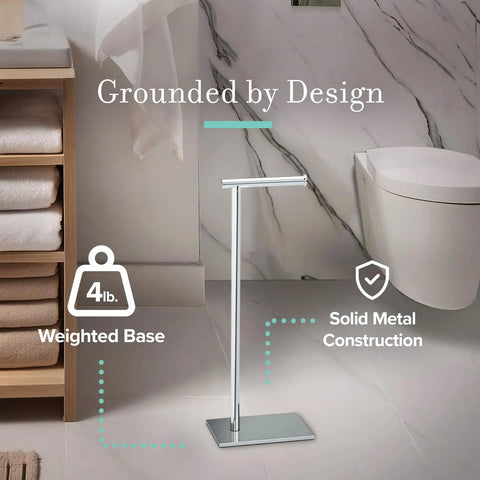 Freestanding Toilet Paper Holder Stand With Weighted Base In Modern Rectangle Chrome Finish For Bathroom Vanity A Must Have Upgrade You Can Move Anytime Grab And Go No Wall Mount Needed Sleek Contemporary Design in bathroom setting.