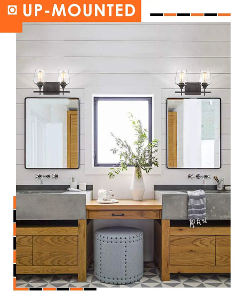 Oil Rubbed Bronze Two Light Bathroom Vanity Fixture Over Mirror With Clear Glass Shades in modern rustic bathroom.