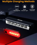 Amped Up Bright USB C Rechargeable Bike Light Set with taillight, battery indicator, and overcharge protection, on black surface.