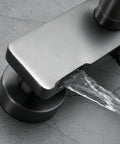 Exposed Shower System with Waterfall Tub Spout Rainfall Shower Set White, copper faucet water flow detail against gray surface.