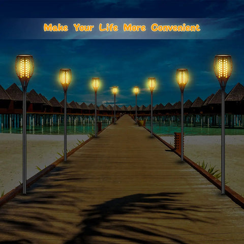 Oceanfront boardwalk lit by 8 Pack Solar Light Stake Replacement Kit With Extension Poles and Joint Connectors at night