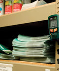 RHT20 Humidity And Temperature Datalogger With 16,000 Reading Memory Dew Point attached to shelf in storage room.