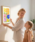 Mother and daughter hanging Punch Needle Kit With 16 Inch Wood Frame For Beginners Create Handmade Wall Art That Mounts Right Away Ready To Hang Framed DIY Craft Set For Home Decor On Your Wall with colorful floral design in wooden frame