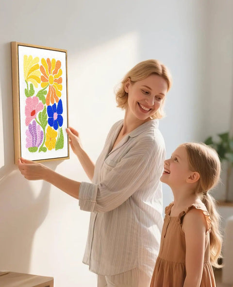 Mother and daughter hanging Punch Needle Kit With 16 Inch Wood Frame For Beginners Create Handmade Wall Art That Mounts Right Away Ready To Hang Framed DIY Craft Set For Home Decor On Your Wall with colorful floral design in wooden frame