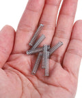 Dope Mini Stainless Steel Compression Spring Kit With 100 Practical Assortment Parts For Easy DIY Home Fix And Car Repair Projects That Actually Stick Around. Mini stainless steel compression springs in hand for DIY repair