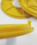 No Sweat Router Table Insert Rings 3 Inch Outside Diameter For Classic Shop Tables showing yellow plastic with detailed edge design.