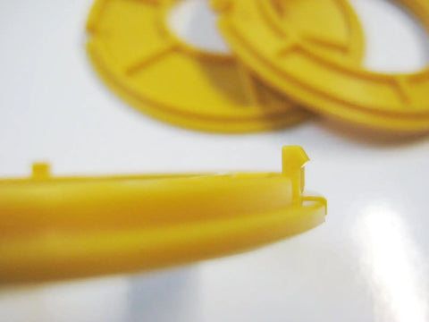 No Sweat Router Table Insert Rings 3 Inch Outside Diameter For Classic Shop Tables showing yellow plastic with detailed edge design.
