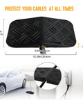 Heavy Duty EV Charger Cable Protector With Handle For Garage Door Gap, sloped rubber cover shown protecting a charging cable.