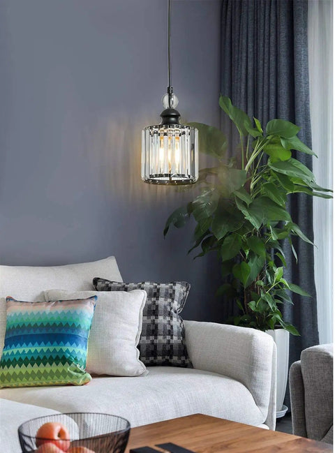 Matte Black Crystal Pendant Lights 3 Pack For Kitchen Island And Dining Room hanging above modern living room setup.