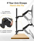 Slick Sit Stand Monitor Arm With Keyboard Tray For Up To 32 Inch Displays, adjusting height with black gas spring arms.