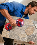 Heavy Duty Vacuum Suction Cup With Double Claw Build For No Sweat Glass Tile And Windshield Handling Multi Function Suction Gripper lifting a large stone tile.