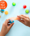 Glow In The Dark Power Balls Diy Stem Kit With 18 Multicolor Crystal Orbs Molds And Instructions Included For Easy Assembly And Bouncy Night Time Fun Tonight. Kids pour crystals into a blue mold
