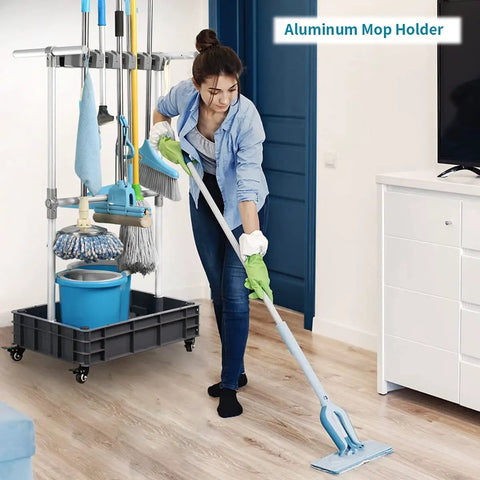 Grab-And-Go Mobile Broom And Mop Organizer Cart With Drying Hooks in use, woman cleaning floor in home setting, tools organized