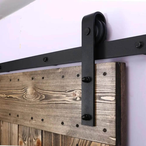 Antique Style Wood Barn Door Hardware Flat Rollers Hangers Black Finish No Sliding Rail installed on rustic wooden door