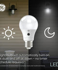Dusk To Dawn Outdoor A21 LED Bulb 13W Daylight White 3 Pack Automatic On Off Security Lighting Easy Install No Fuss In Standard E26 Socket Weatherproof Porch Light Energy Efficient Long Lasting Illumination displayed with auto sensor icons.