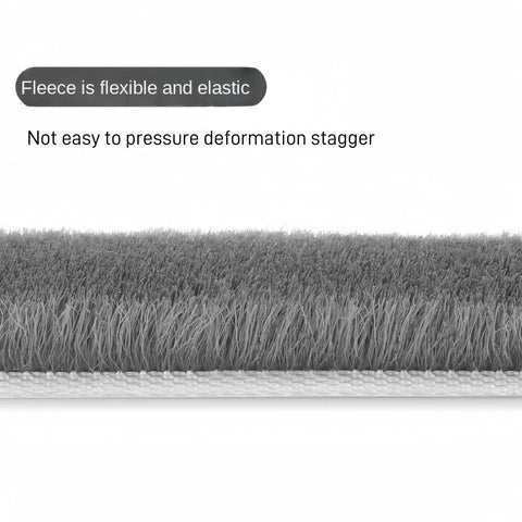 Gray brush-style window and door weather stripping seal with self-adhesive backing.