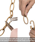 Hands adjusting Antique Gold Lighting Chain For High Ceilings 19.7 Ft Heavy Duty Chandelier Pendant Extension with pliers and locks.