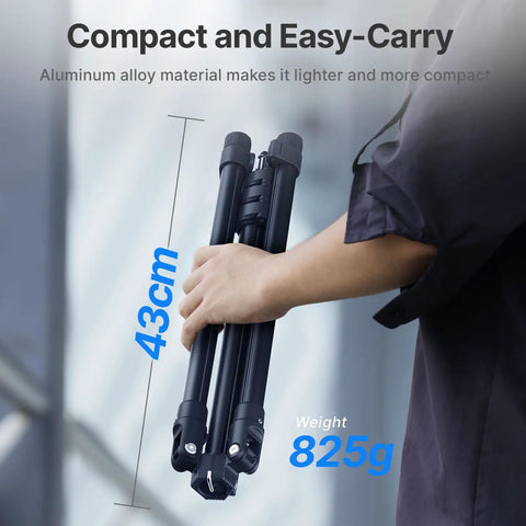 Person holding a folded Extendable 6.23ft Aluminum Light Stand For Photography, Reversible Portable Studio Tripod, 43cm compact size.
