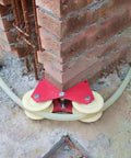 Heavy Duty Double Pulley System With Steel Rings And Nylon Groove Wheel in use around a wall corner, construction site setting