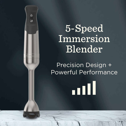 Hella Powerful Immersion Blender With Five Speed Settings And A 625-Watt Motor That Handles Whole Foods And Creates Creamy Soups Smoothies And Baby Food In Sleek Stainless Steel Finish on a marble surface.