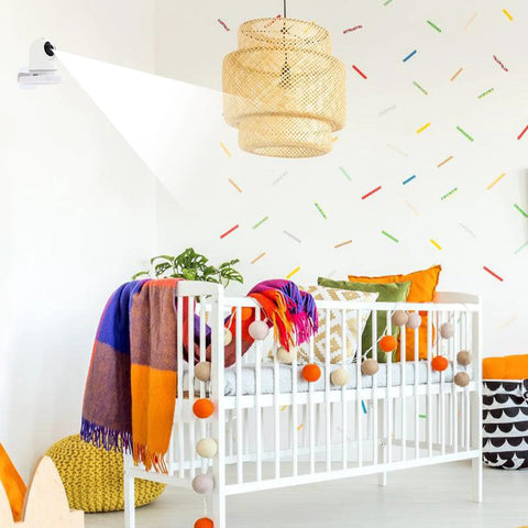 4 Pack Adhesive Wall Mounts for security cameras in a colorful bedroom with crib and decor