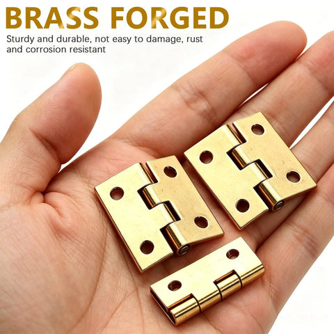 Four Pack Mini Brass Folding Butt Hinges One Inch Retro Style With Mounting Screws shown on hand for size reference