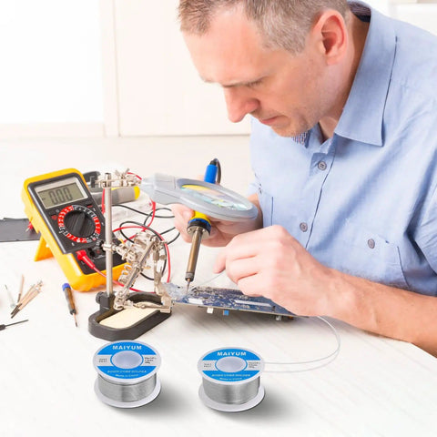Person using 63-37 Tin Lead Rosin Core Solder Wire for Electrical Soldering, 0.8mm Diameter, 50g Spool, on a circuit board
