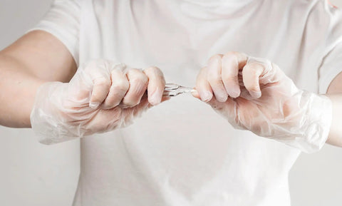 Hands wearing Straight Up Premium Clear Vinyl Exam Gloves Large 1000 Pack Latex Free Powder Free, demonstrating flexibility.