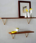 Built Tough Hidden Triangle Wall Shelf Brackets Rock Solid Heavy Duty Floating Bracket Kit For Diy Bookshelf Storage And Clean Modern Home Decor Upgrade Two Piece Black Metal with wooden shelves and decor.