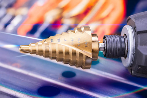 Titanium Nitride Coated HSS Step Drill Bit With One Quarter Inch Hex Shank Ten Imperial Step Sizes From One Quarter Inch To One And Three Eighths Inch Spiral Groove Double Flute 135 Degree Split Point For Sheet Metal Aluminum PVC Copper Acrylic NordWolf attached to a drill