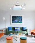 42 Inch Retractable Ceiling Fan With Lights And Bluetooth Speaker, modern living room setting, hidden blades, LED lighting.